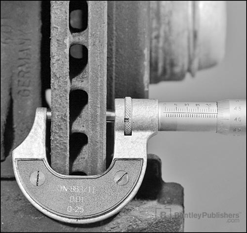 Measuring brake rotor wear.
Excerpted illustration from Merecedes-Benz C-Class Service Manual: 1994-2000 Section 00.04 Maintenance BentleyPublishers.com watermark not printed on actual product.)